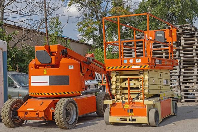 industrial forklift navigating through packed warehouse shelves in Elm Grove